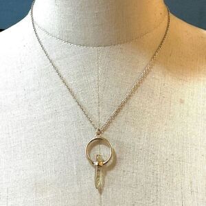 Gold tone pendant necklace